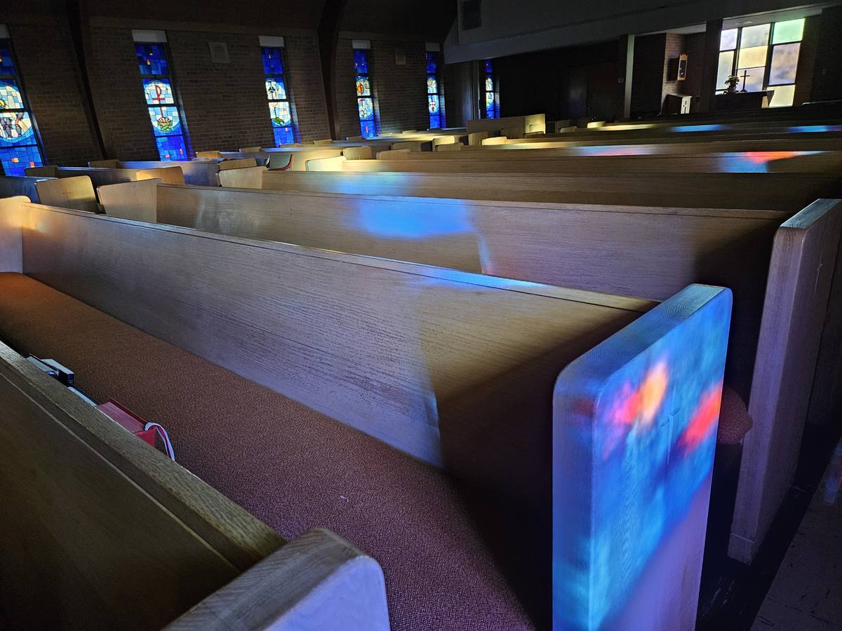 Sanctuary pews and stained glass